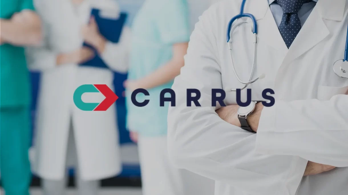 An image of medical providers in the background with their arms crossed and speaking, with the Carrus logo superimposed on the front of the image.