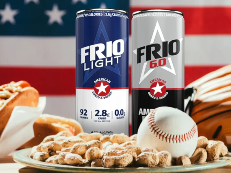 An image of Frio beer with peanuts, a baseball, hotdogs, and a USA flag behind the image.